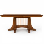 Front view of Moriss solid wood dining table with thick top and sculpted base